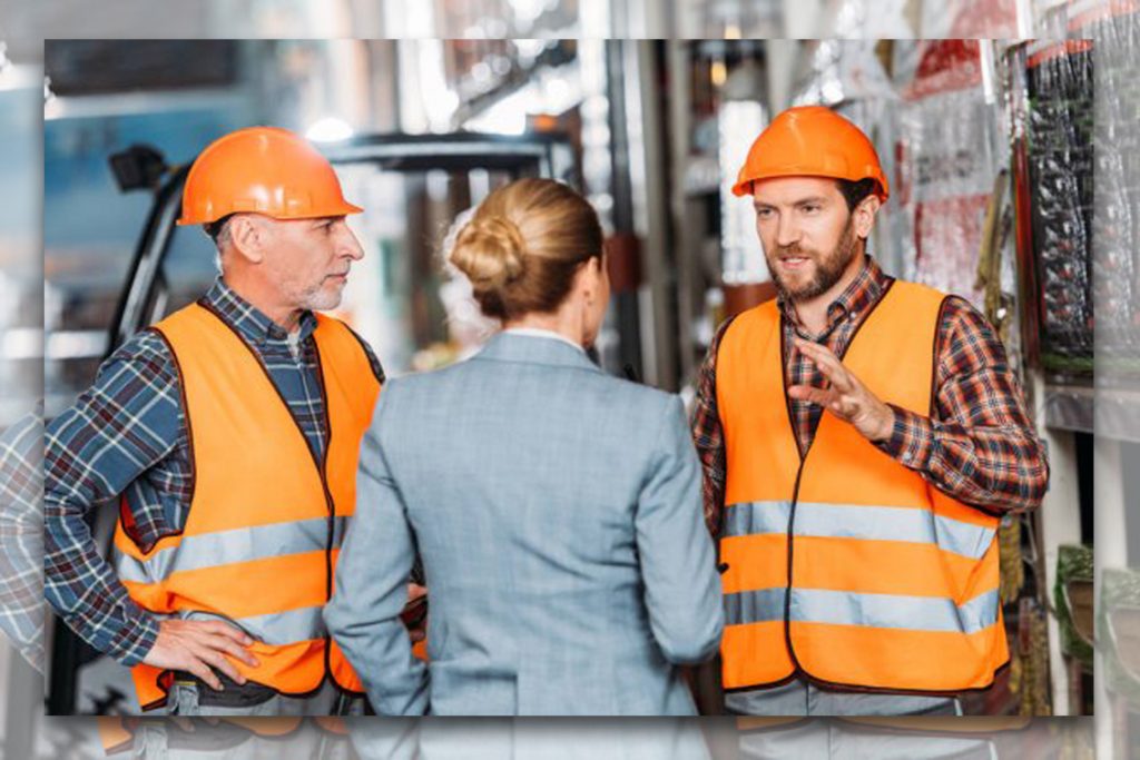 construction workers discuss with client